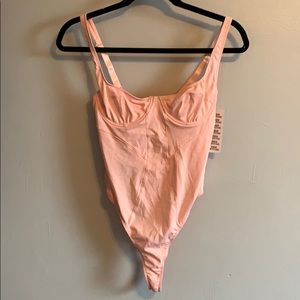 Pink bodysuit